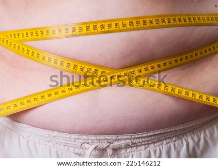 Fat Woman measuring her waist