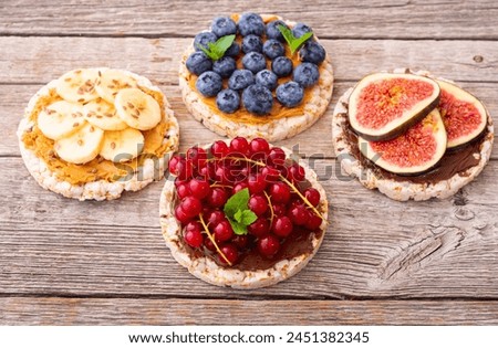 Similar – Foto Bild Frische Heidelbeeren, rote Johannisbeeren und Himbeeren, Seitenansicht mit Platz für Text