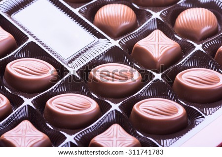 Closeup brown chocolate candy background .
