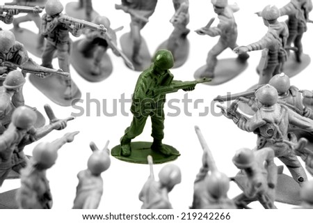 toy green army man surrounded