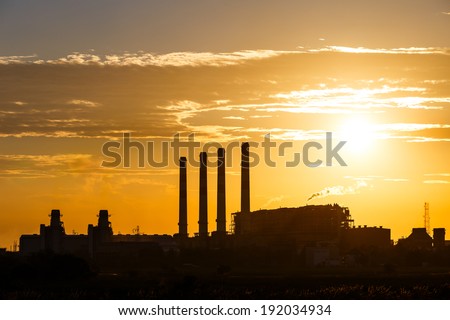 Orange sunset and cloud over gas turbine  electrical power plant
