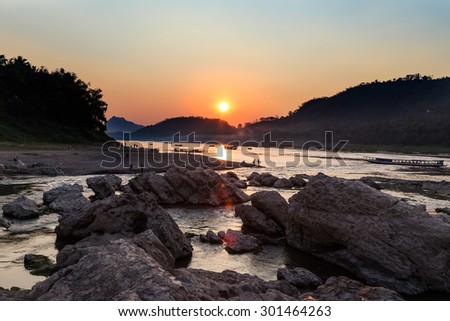 Sunset over mountain and river in luangprabang,  Laos