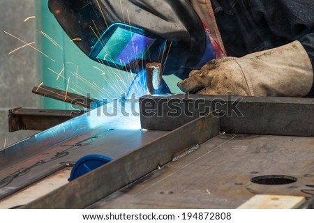 Skill worker performs gas metal arc welding (especially metal inert gas or MIG welding)