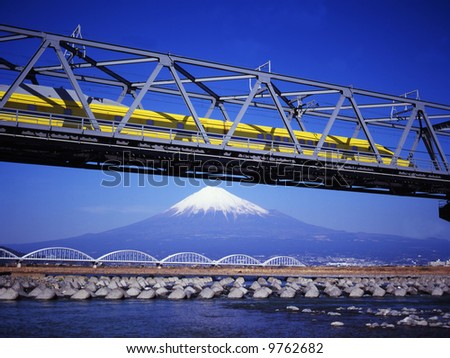 The Shinkansen Yellow doctor runs over Mt,Fuji peak