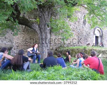 Rock artist having a live performance on the grass at a Roman fortress (Romania) (2)