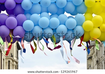 Colorful balloons closeup with developing colorful ribbons