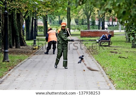 GOMEL, BELARUS - AUGUST 27:In Belarus, the whole country was held a community work day on cleaning of parks and squares on August 27, 2012 in Gomel, Belarus. In photo janitors clean the park