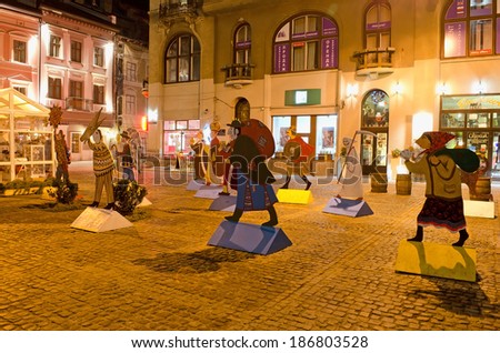LVOV, UKRAINE - DECEMBER 28: Symbol of Christmas - Characters of Christmas carols, made of plywood, one of the squares in the center of Lvov on December 28, 2013 in Lvov, Ukraine