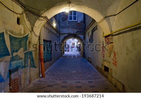 LVOV, UKRAINE - FEBRUARY 27, 2014: Landmark in the center of Lvov - arched gate to the old patio on February 27, 2014 in Lvov, Ukraine