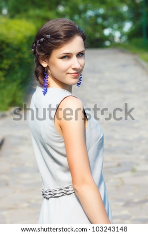The fine young girl with a light dress. Romance style