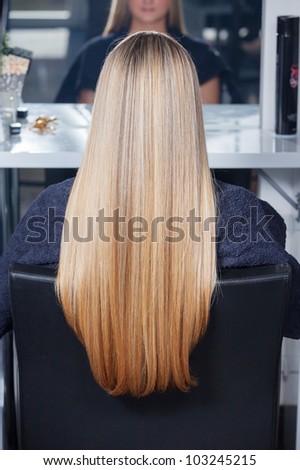 Beautiful long hair. Woman in salon