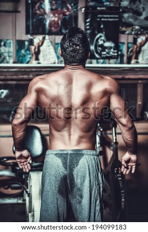 Muscled male model showing his back