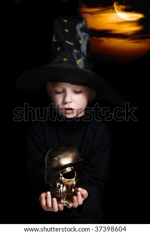 The small magician with a gold skull of dead pirate