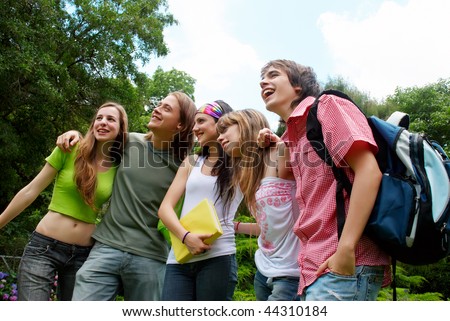 happy young students in park