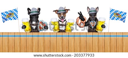 three bavarian  dogs behind a fence with beer mugs and pretzel bread
