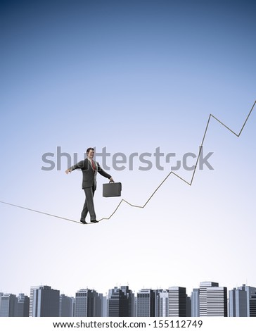 Businessman on a graph shaped tightrope - success and risk concept