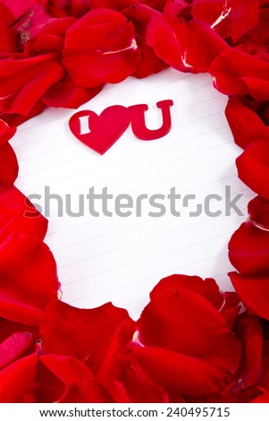 Frame made with red rose petals with blank for a copy space and \