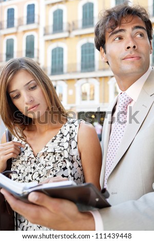 Close up portrait of two business people having a meeting in a classic city center.