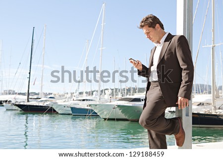 Wide view of a businessman using his \