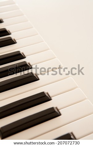 Close-up still life detail view of a piano keyboard black and white keys in a diagonal position, interior. (Object, Music, Entertainment).
