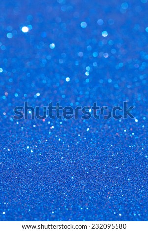 Abstract blue color glitter festive background frame with shining stars and galaxy like feel. Christmas decorative and festivity celebration background texture. Luxury texture white glitter.