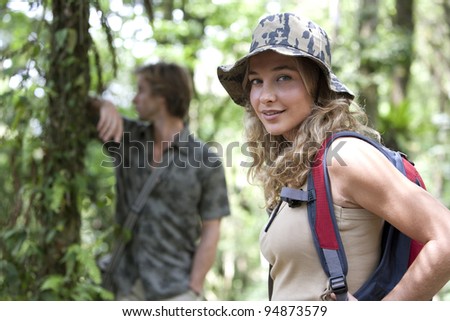 Man and woman in a forest expedition.