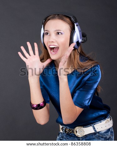 Music bright girl with headphones, background is black