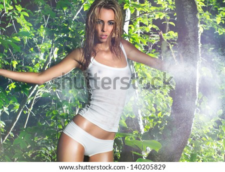 Young and wild woman in jungle