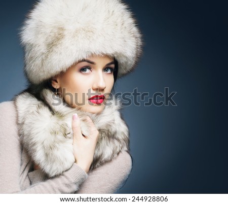 Fashion style portrait of a woman in an elegant winter fury clothes