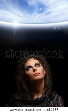 Portrait of witch over dark background
