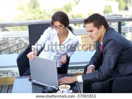 Business couple (Warning! Low depth of filed, man\'s face is a little bit blurry)