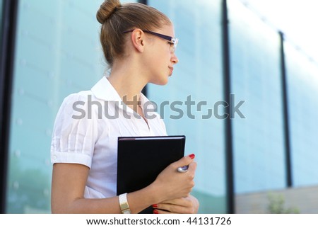 Young attractive woman in casual dress (student or businesswoman)