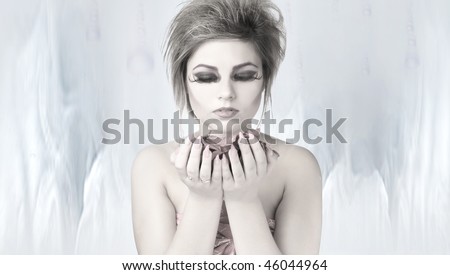 Young beautiful fantasy woman over dream background