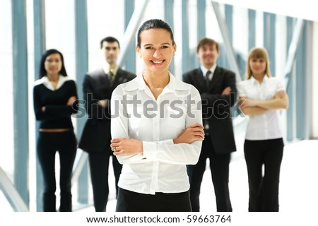 Business people in office (WARNING! Focus only on the lady in front of image)