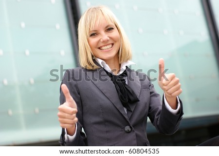 business woman shows the signs of success