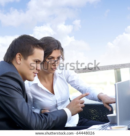 Business couple (Warning! Only woman\'s face is in focus, man\' face is out of focus!)