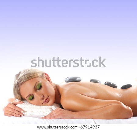 Young attractive sexy blond getting spa treatment isolated on white background