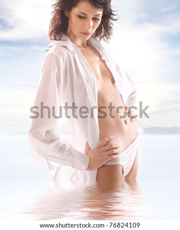 Attractive lady wearing wet female shirt