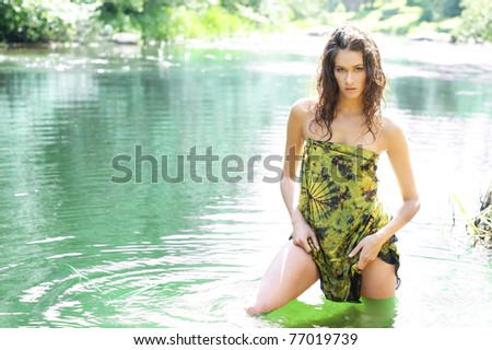 Young sexy wild woman in the water