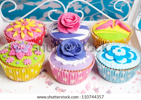 Six colorful party cupcakes for wedding or birthday party