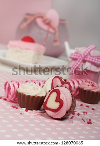 Chocolate cupcakes with strawberry wedding cake