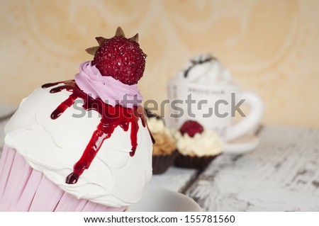 strawberry cupcake with coffee and whipped cream