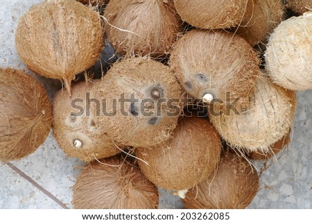 peeling coconuts fruit background