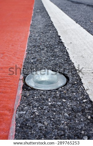 Round glass reflector on the road To prevent damage
