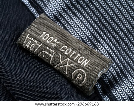 Old one hundred percent cotton tag of jeans.
