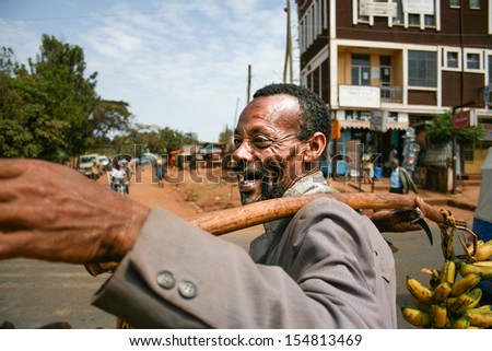 DILLA, ETHIOPIA - DECEMBER 23: Happy hawker sells bananas on the street in Dilla on December 23, 2008 in Dilla, Ethiopia.