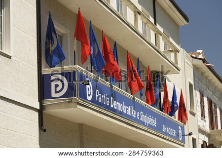 SHKODRA, ALBANIA - May 30, 2015. Flags on the building of a political party in a democratic Albania, Shkodra.