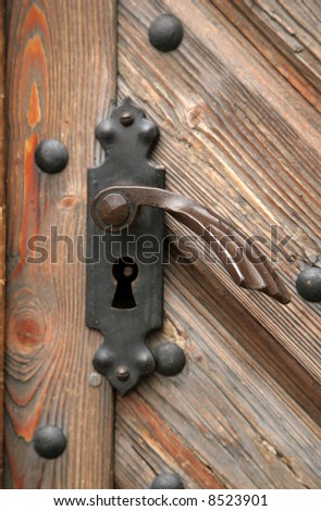 The old metal handle of a door