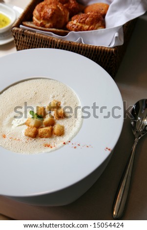 Plate of soup and bread on a table