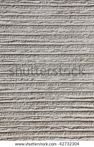 Relief horizontal lines on a white wall